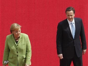 Cameron en Merkel: sterke euro noodzakelijk