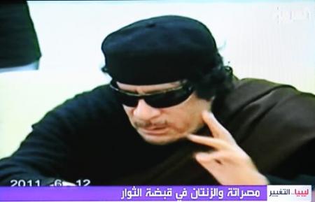'Kaddafi wil over overdragen macht praten'
