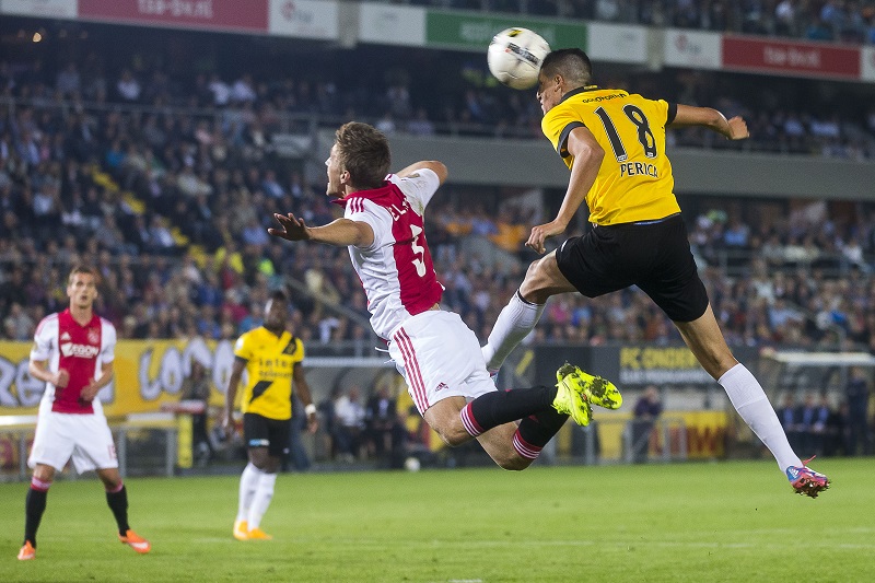 Een duel tussen NAC Breda-speler Stipe Perica en Ajax-speler Joël Veltman (PRO SHOTS/Joep Leenen)