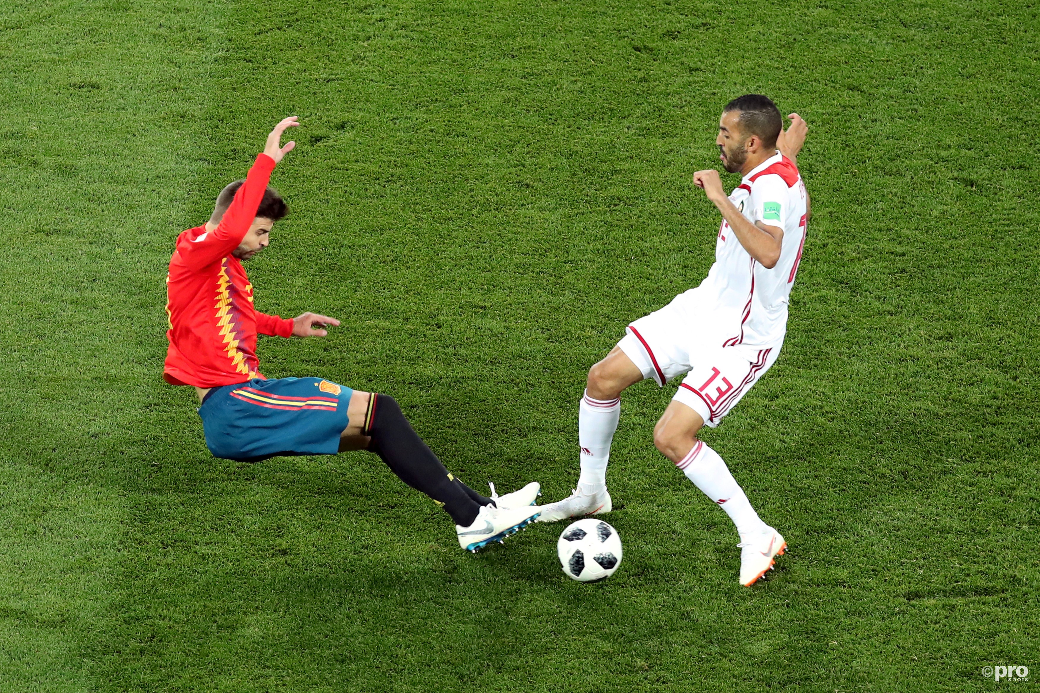 Gerard Pique in action with Morocco's Khalid Boutaib. (PRO SHOTS/Action Images)